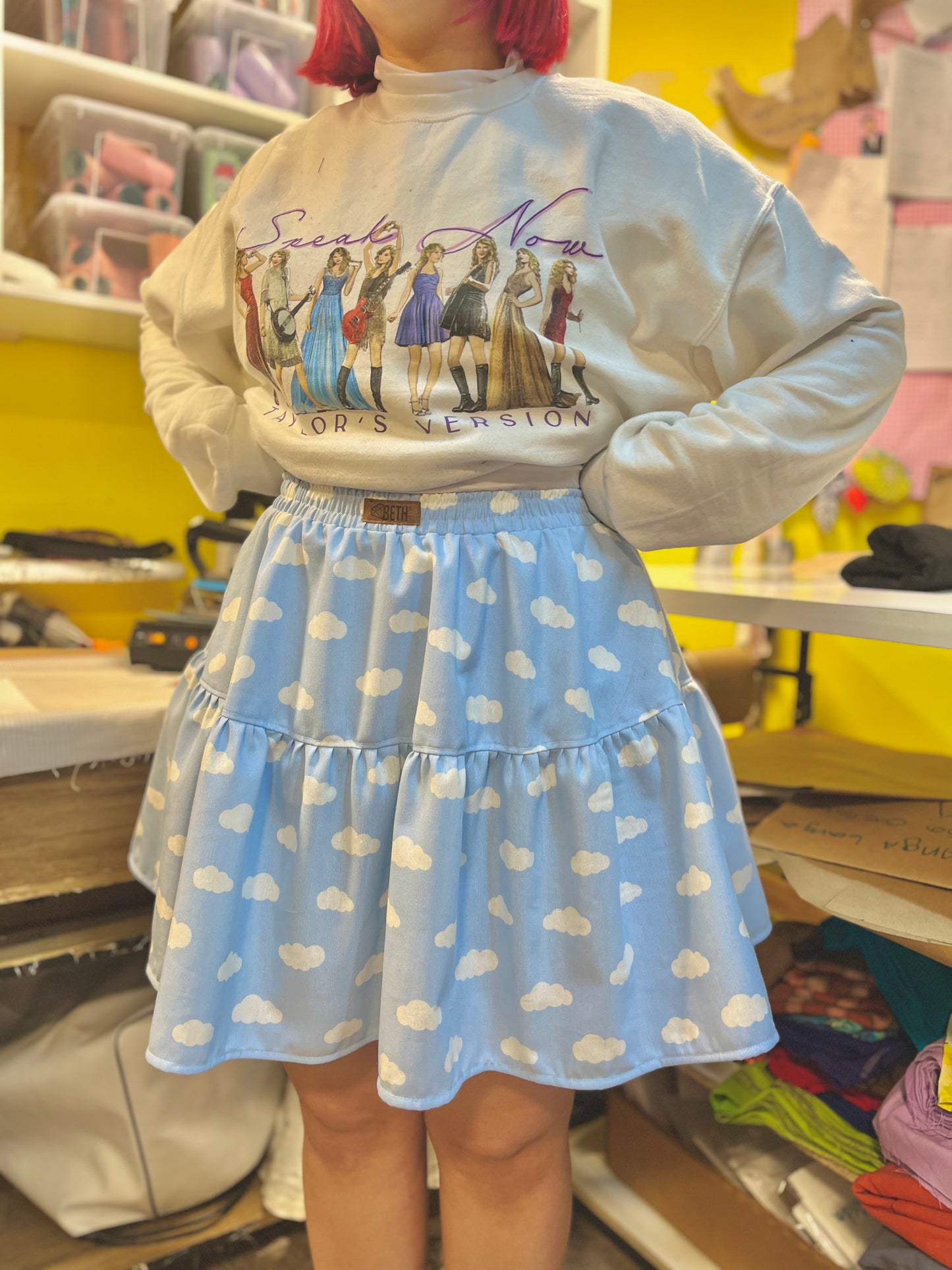 Mini falda Maya celeste nubes